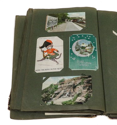 Lot 201 - A Box, containing 2 postcard albums and 2...