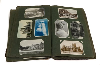 Lot 201 - A Box, containing 2 postcard albums and 2...