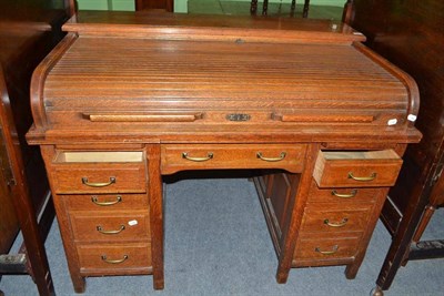 Lot 745 - An Edwardian oak roll top desk