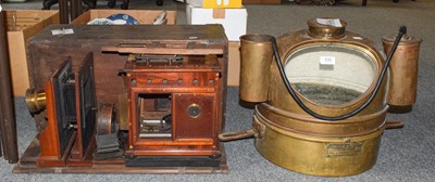 Lot 330 - A Victorian magic lantern in pine case and a...