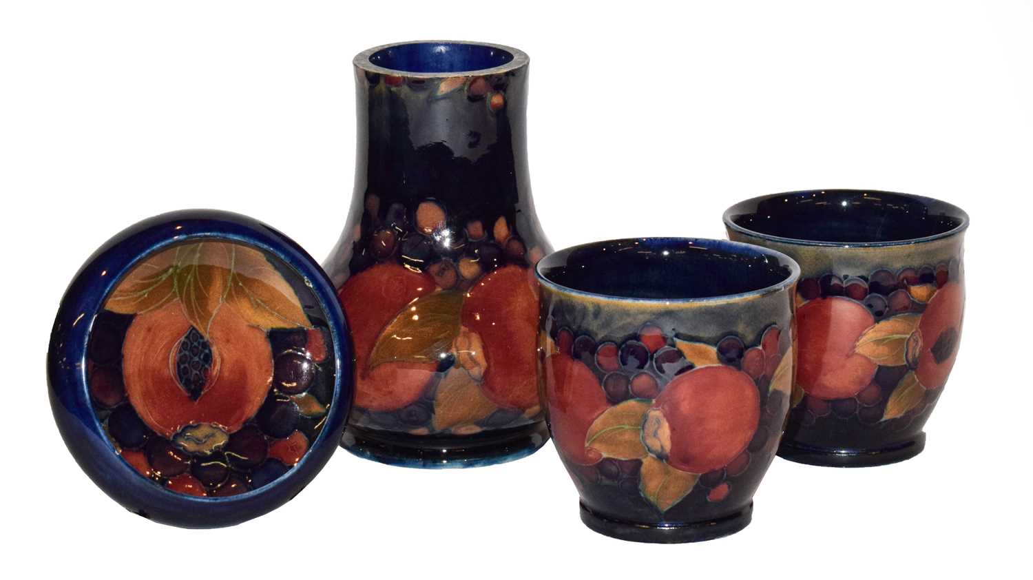 Lot 83 - A pair of William Moorcroft Pomegranate vases,...