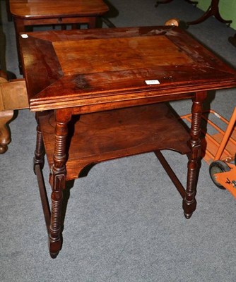 Lot 749 - A fold-over card table on turned supports with gallery below