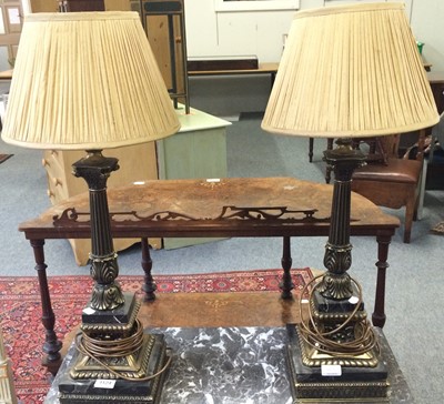 Lot 1124 - A pair of gilt metal and marble table lamps