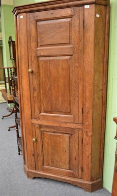 Lot 750 - Elm floor standing corner cupboard