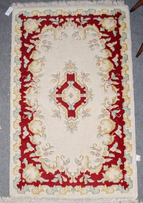 Lot 1013 - Indian 'Savonnerie' Rug, the ivory field with...