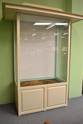 Lot 756 - A modern pagoda top glazed display cabinet