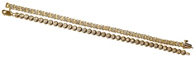 Lot 116 - A diamond line bracelet, clasp stamped '375';...