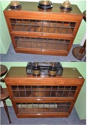 Lot 761 - A pair of Globe Wernicke two section bookcases with leaded glass panels