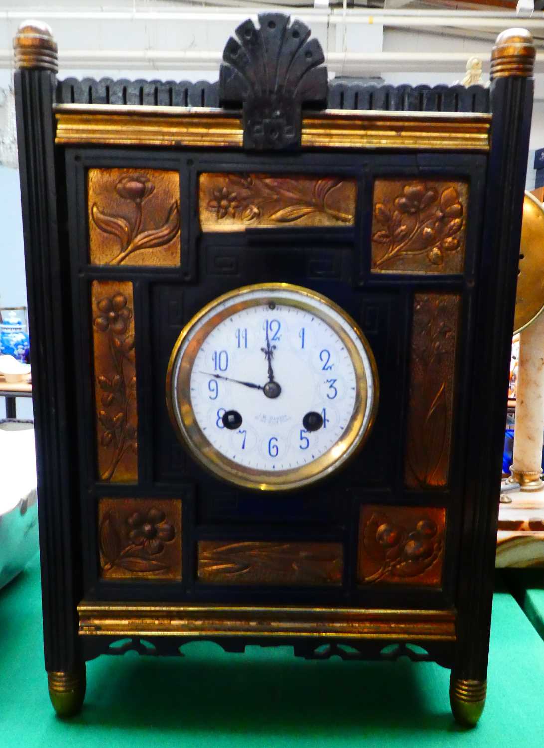 Lot 297 - An Aesthetic movement mantel clock in ebonized...