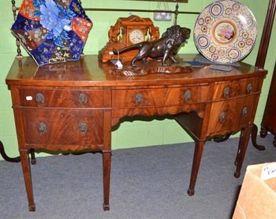 Lot 766 - A Regency mahogany bow fronted sideboard with cellarette drawer