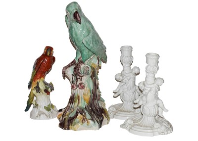 Lot 272 - A Dresden model of a parrot perched on a tree...