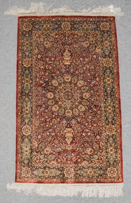 Lot 1008 - A Chinese silk rug, the fox brown field with...