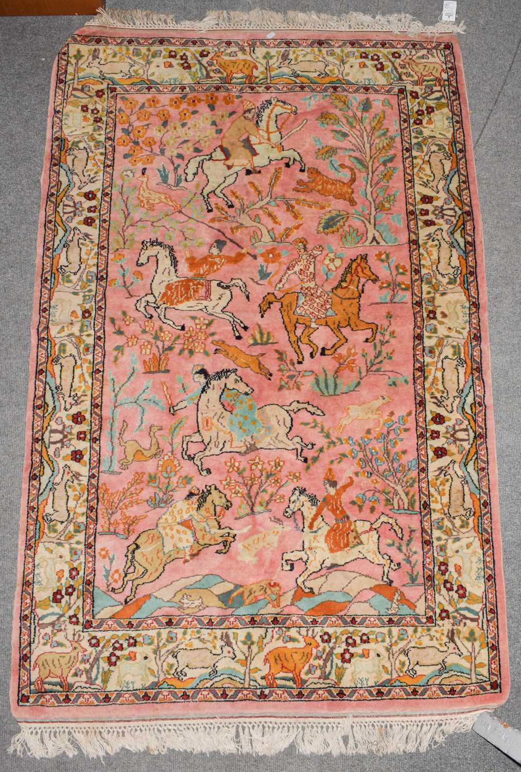 Lot 1010 - An Indian rug the candy pink field with
