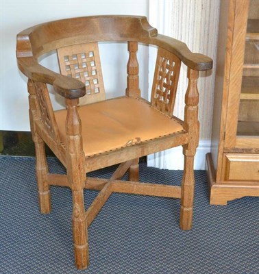 Lot 956 - A Robert  "Mouseman " Thompson Oak Monks Chair, with curved back and shaped arms, over three...