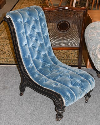 Lot 1170 - A Late Victorian Ebonised Chaise Longue,...