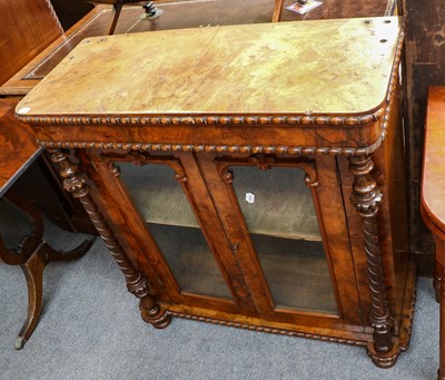 Lot 1087 - A Victorian Figured Walnut Bookcase, with two...