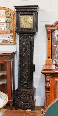 Lot 1346 - A carved oak thirty-hour single hand longcase...