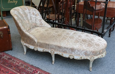 Lot 1172 - A cream and parcel gilt chaise longue in Louis...
