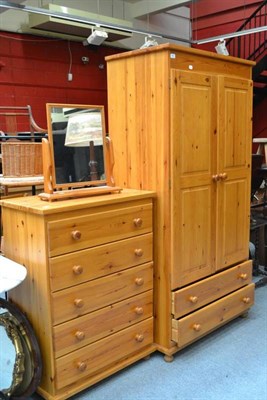 Lot 809 - A modern pine wardrobe, chest of drawers and mirror