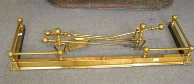 Lot 810 - Brass fire curb and companion set