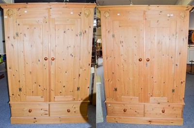 Lot 1114 - A pair of modern pine double wardrobes 146cm...