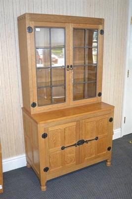 Lot 958 - A Robert  "Mouseman " Thompson Oak Drinks Display Cupboard, the glazed upper section with three...