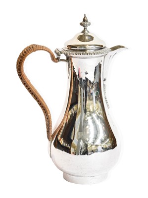 Lot 83 - A George III Silver Hot-Water Jug, by Augustin...