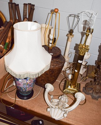 Lot 319 - A brass based table lamp of Corinthian column...