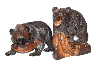 Lot 262 - Two reproduction Black Forest style carved...