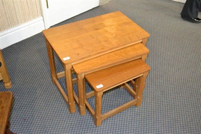 Lot 962 - A Robert  "Mouseman " Thompson Oak Nest-of-Tables, on four octagonal legs, each with carved...