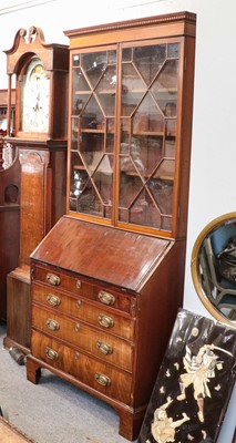 Lot 1178 - A George III mahogany glazed bureau bookcase,...