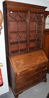 Lot 1183 - A George III mahogany glazed bureau bookcase,...