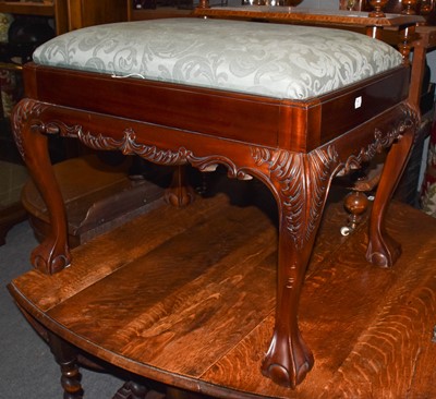 Lot 1222 - A reproduciton mahogany stool on ball and claw...