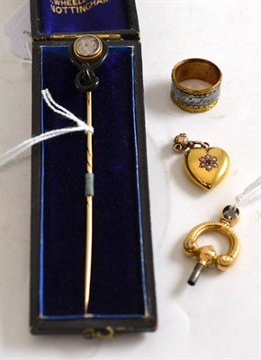 Lot 8 - A mourning pin, cased, a heart shaped charm, a stirrup shaped watch key and two colour ring