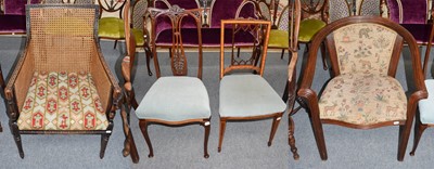 Lot 1241 - A 1920s bergere chair, two Edwardian mahogany...