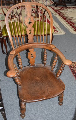 Lot 1242 - A 19th century Elm Windsor chair with twin...