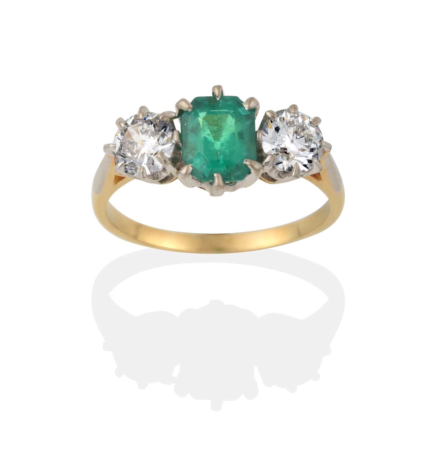 Lot 2031 - An Emerald and Diamond Three Stone Ring