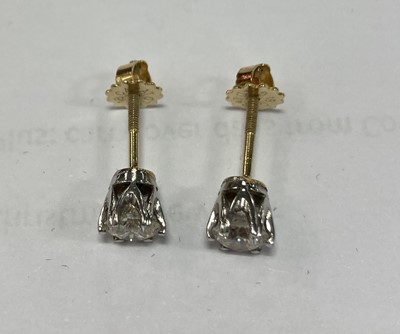 Lot 2417 - A Pair of Diamond Solitaire Earrings