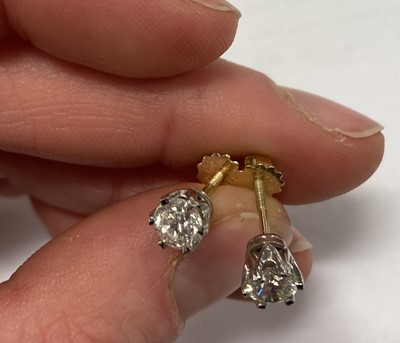 Lot 2417 - A Pair of Diamond Solitaire Earrings