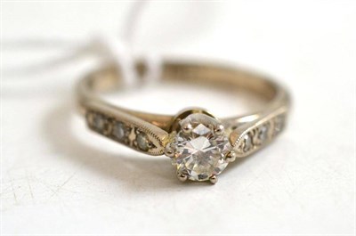 Lot 20 - A diamond solitaire ring, with stone set shoulders