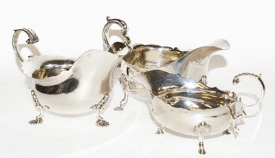 Lot 231 - Three silver sauceboats, one by Walker and...