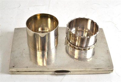 Lot 22 - Silver cigarette case and two silver napkin rings (3)