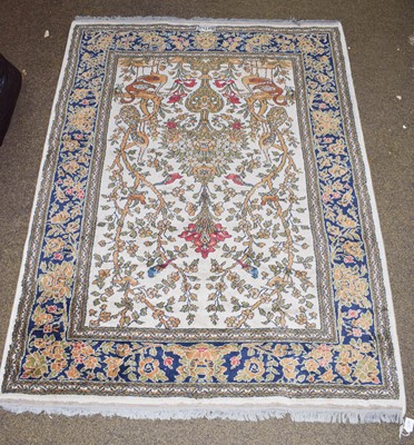 Lot 1225 - A machine made rug of Iranian prayer design,...