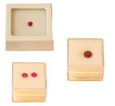 Lot 261 - Four loose rubies including two oval cut...