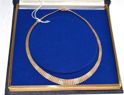 Lot 36 - A three colour fringe necklace, stamped 'KT9'