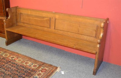 Lot 967 - A Robert  "Mouseman " Thompson 6'6 " Oak Pew, with panelled back and shaped ends, each with...