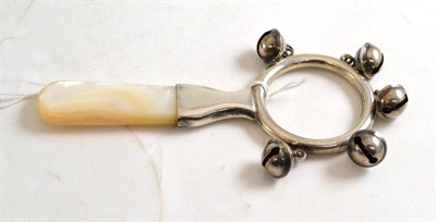 Lot 49 - Silver and mother-of-pearl teething ring/rattle