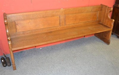 Lot 968 - A Robert  "Mouseman " Thompson 6'6 " Oak Pew, with panelled back and shaped ends, each with...