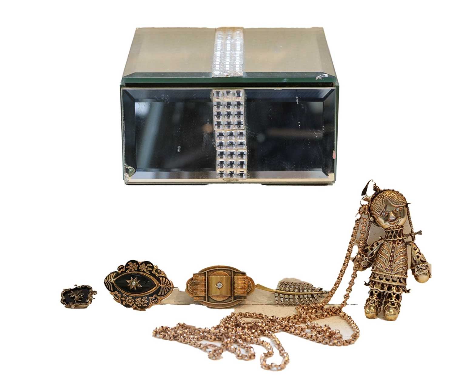 Lot 301 - A silver gilt articulated doll pendant with...
