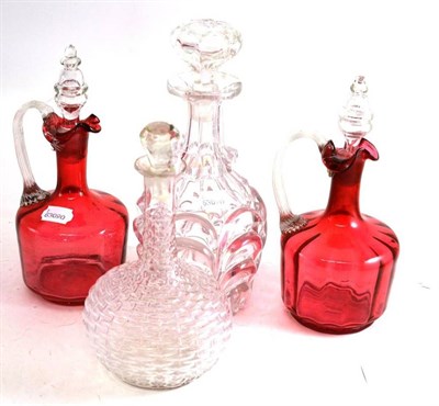 Lot 67 - A pair of cranberry decanters and two other 19th century decanters (4)